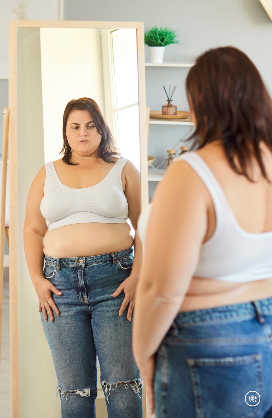 Woman looking at her own reflection